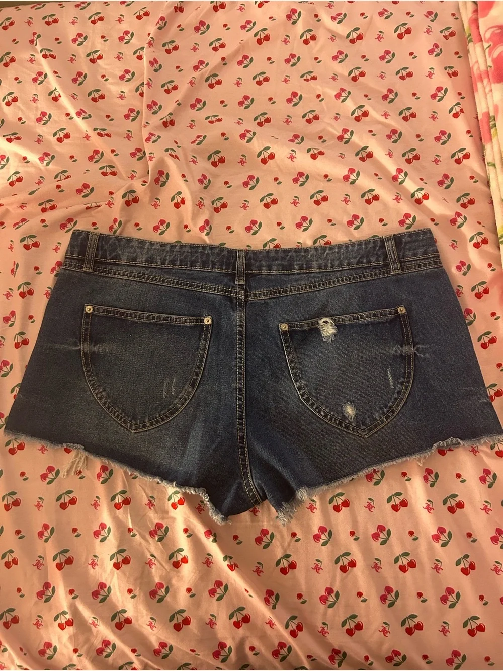 Low-Rise Dark Blue Denim Cutoff Shorts with Distressed Hem